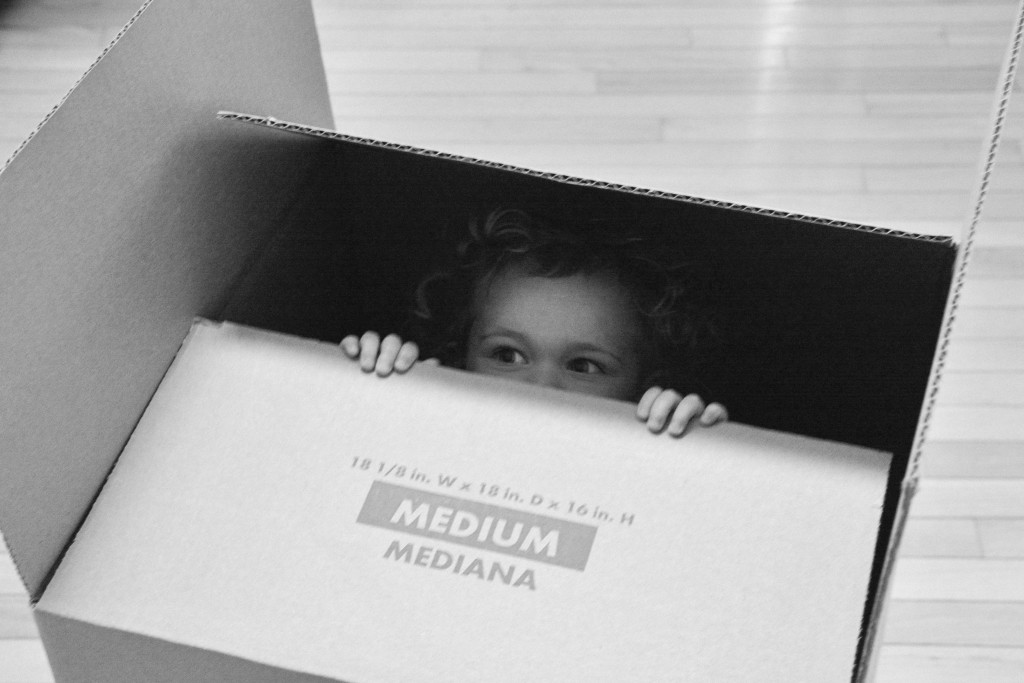 Emma spent a lot of her day playing with moving boxes. Liam followed along.