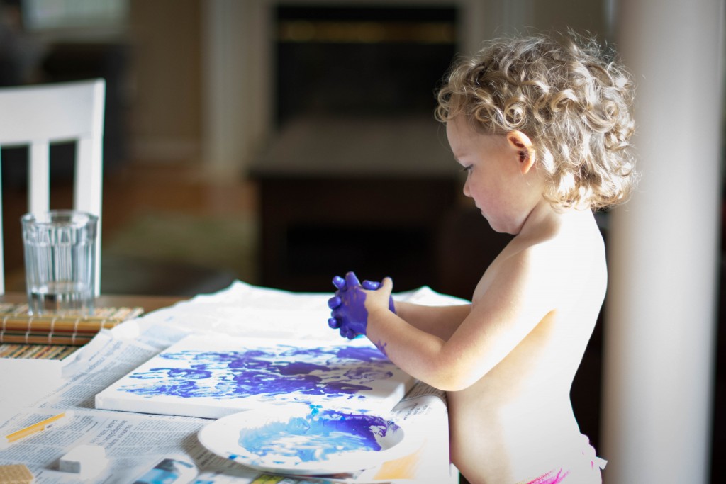 Emma wanted to paint  canvas for daddy with handprints. We're going to add another color Of course, we had to start with purple. It's her favorite.