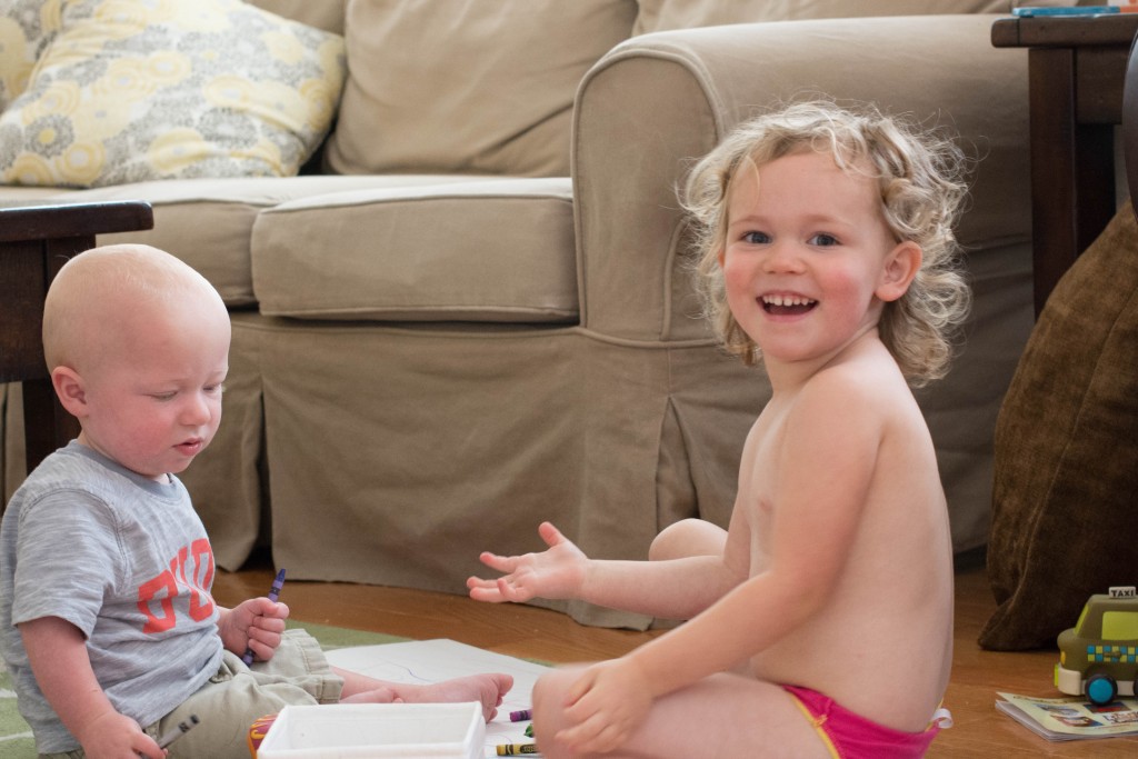 Emma was testing me seriously this morning. This is her "I'm trying to get away with this" look. I told her not to spill crayons. I told her to wear a shirt. I told her to keep them away from Liam. You see she didn't listen at all.