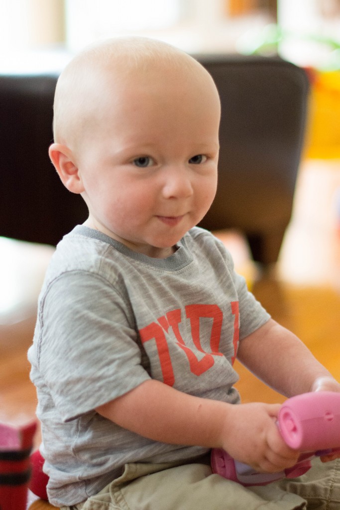 I just love this look. He was so proud of himself...he turned on Emma's camera.