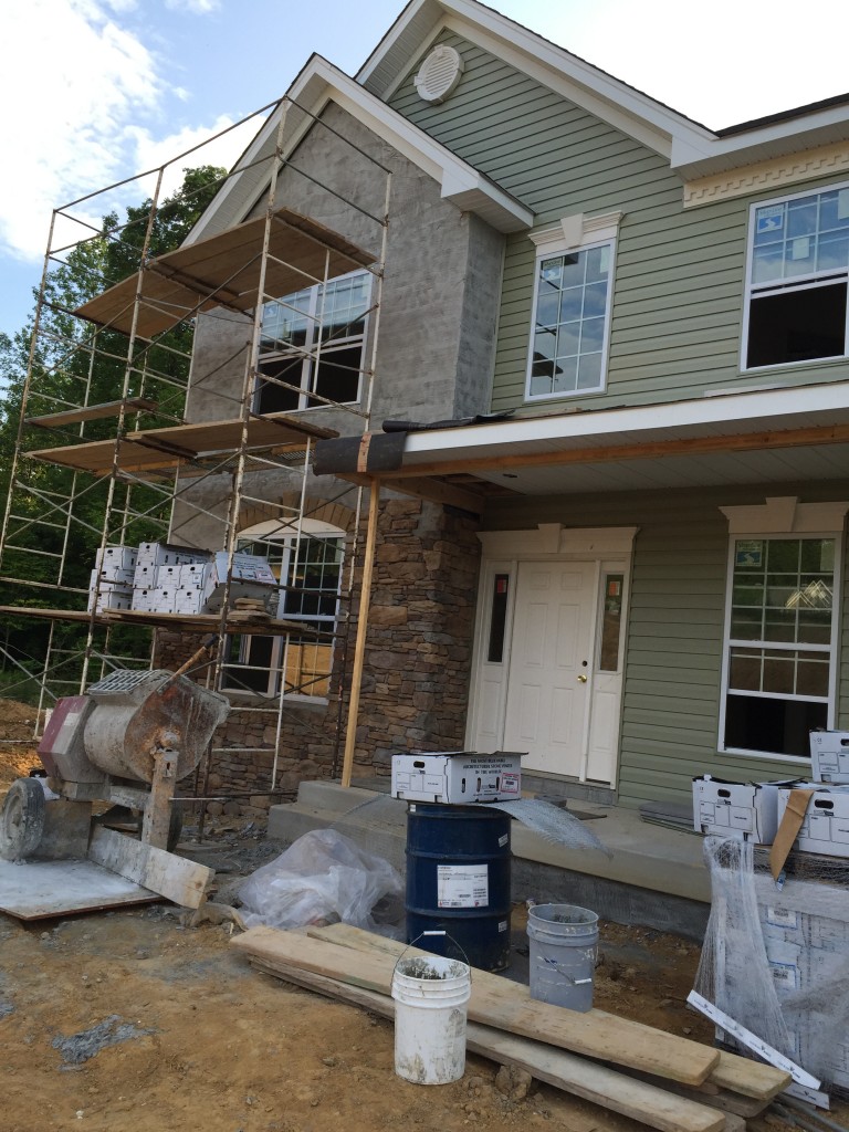 We went to check out the new house. Not much changed on the inside but they've got about 1/3 to 1/2 of the outside stone done. I'm still not sure that they're going to be done by July 6 like they've promised, though....